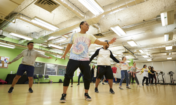 A group of students dancing in a dance studio